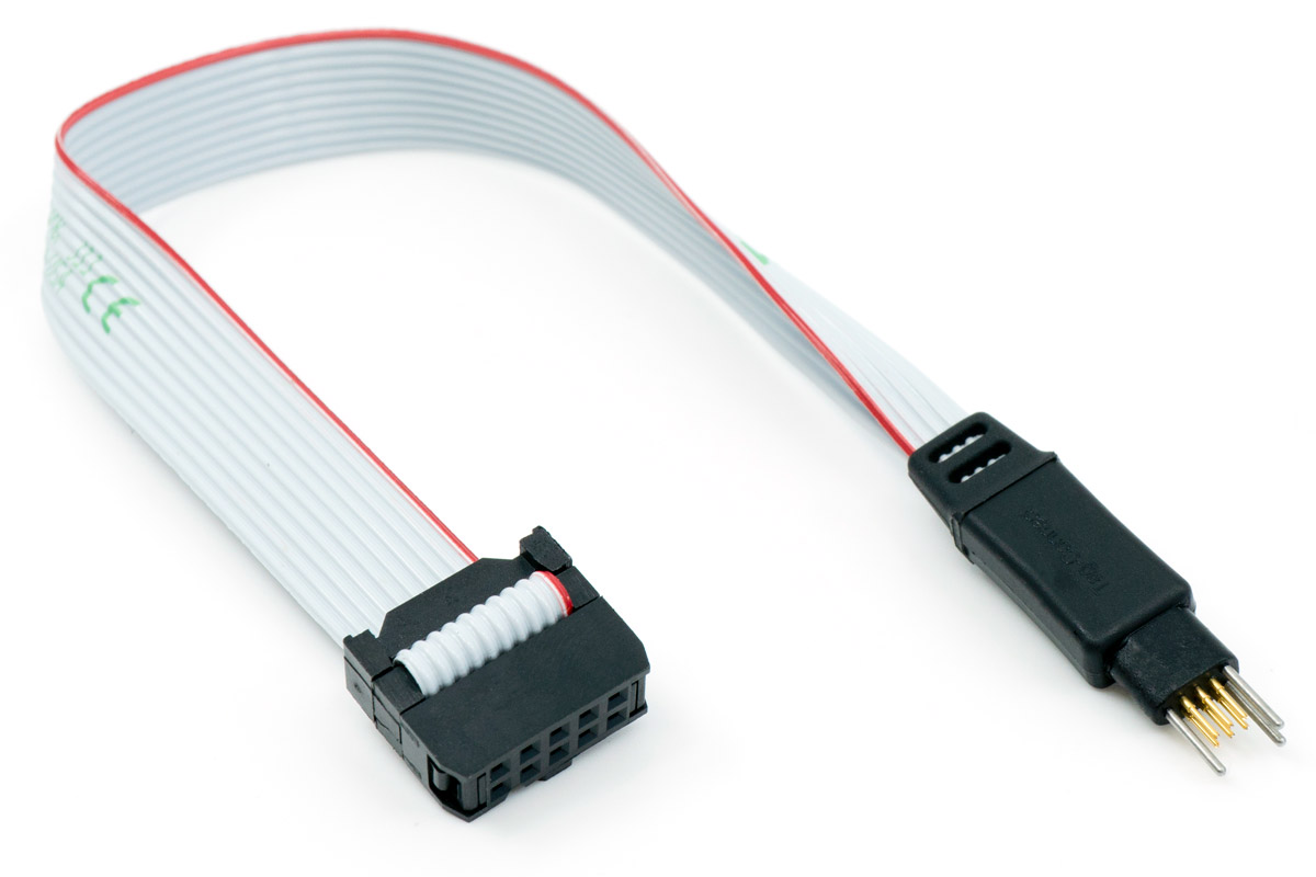 The TC2030-ALT-NL cable in full length, with the 6-pin Tag-Connect connector with spring pins, no legs at one end and the 10-pin IDC connector on a 2.54 mm pitch at the other.